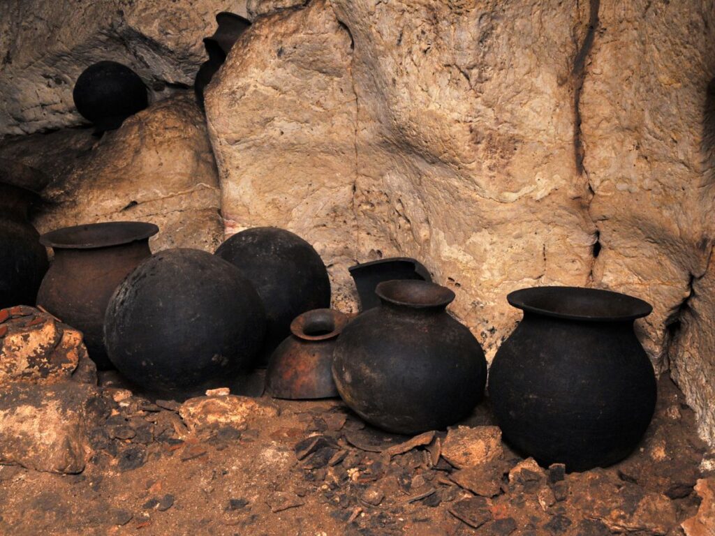 Six ancient Mayan pots in a cave in Belize.