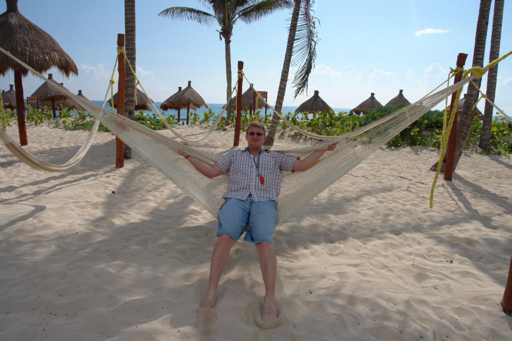 David on a hammock on the beach in Riviera Maya Mexico