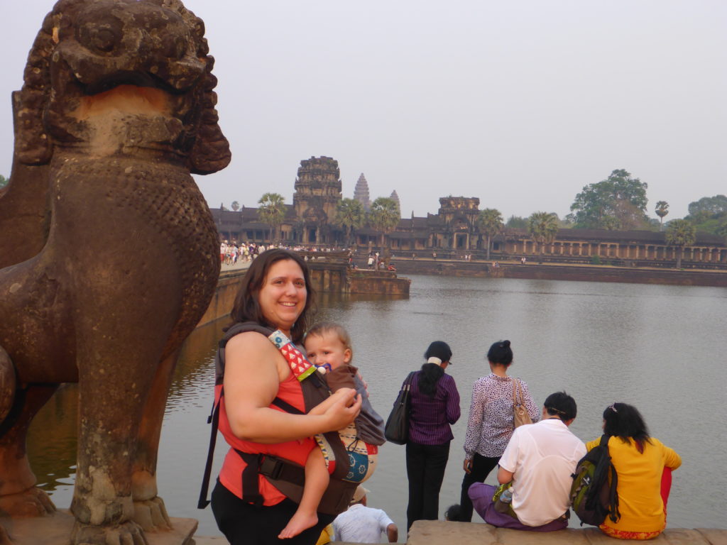 Brodi and Little Man in a baby carrier in front of the main temple at Angkor Wat with Kids