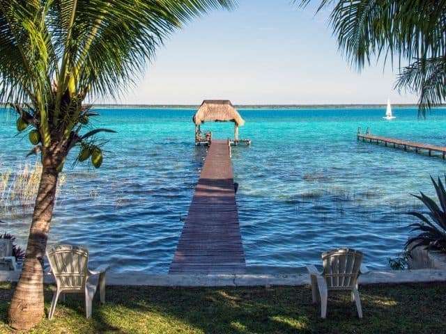 Relaxing on a pier is one of the best things to do in bacalar with kids.