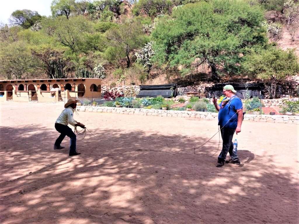 David getting roped by a cowboy after our San Miguel de Allende horseback riding day.