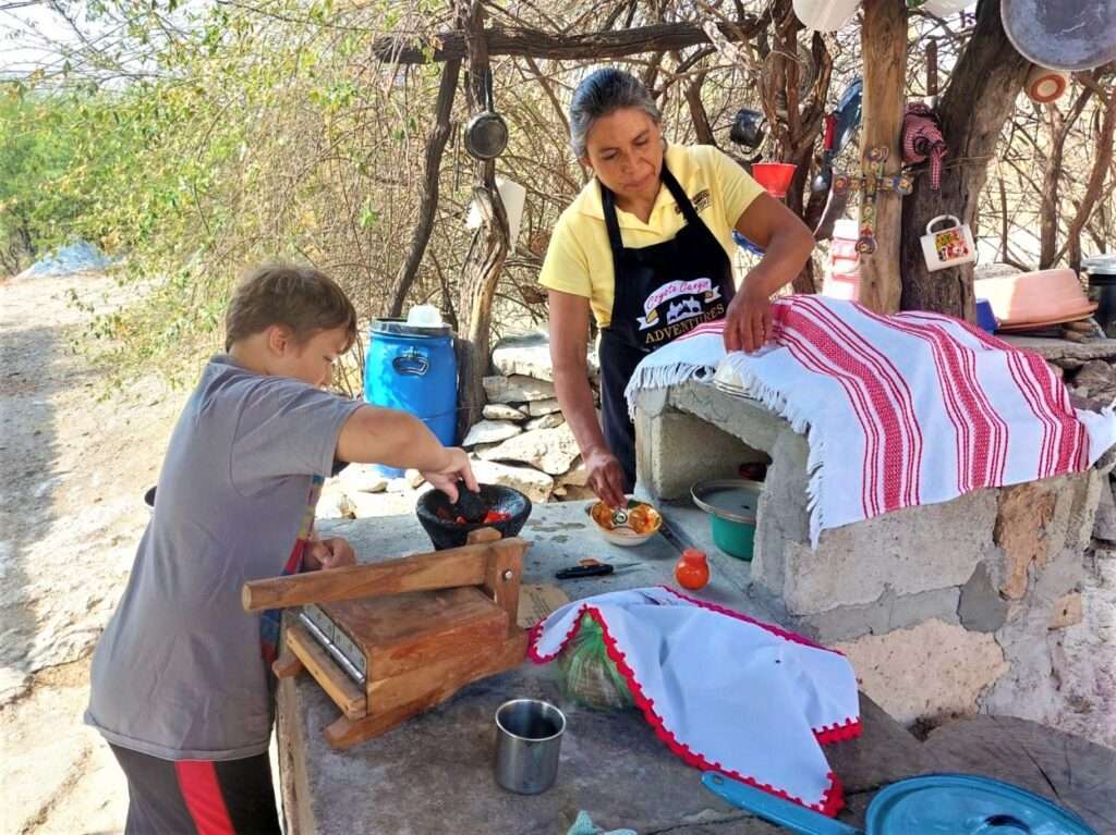 Little Man making salsa before san miguel de allende horseback riding.