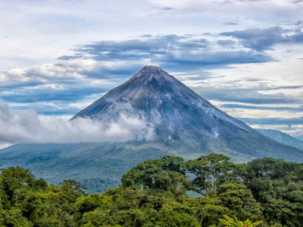 Arenal volcano in Costa Rica, with clouds surrounding the summit.