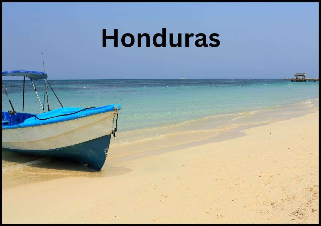 A beached boat in Honduras with the word "Honduras" above it.