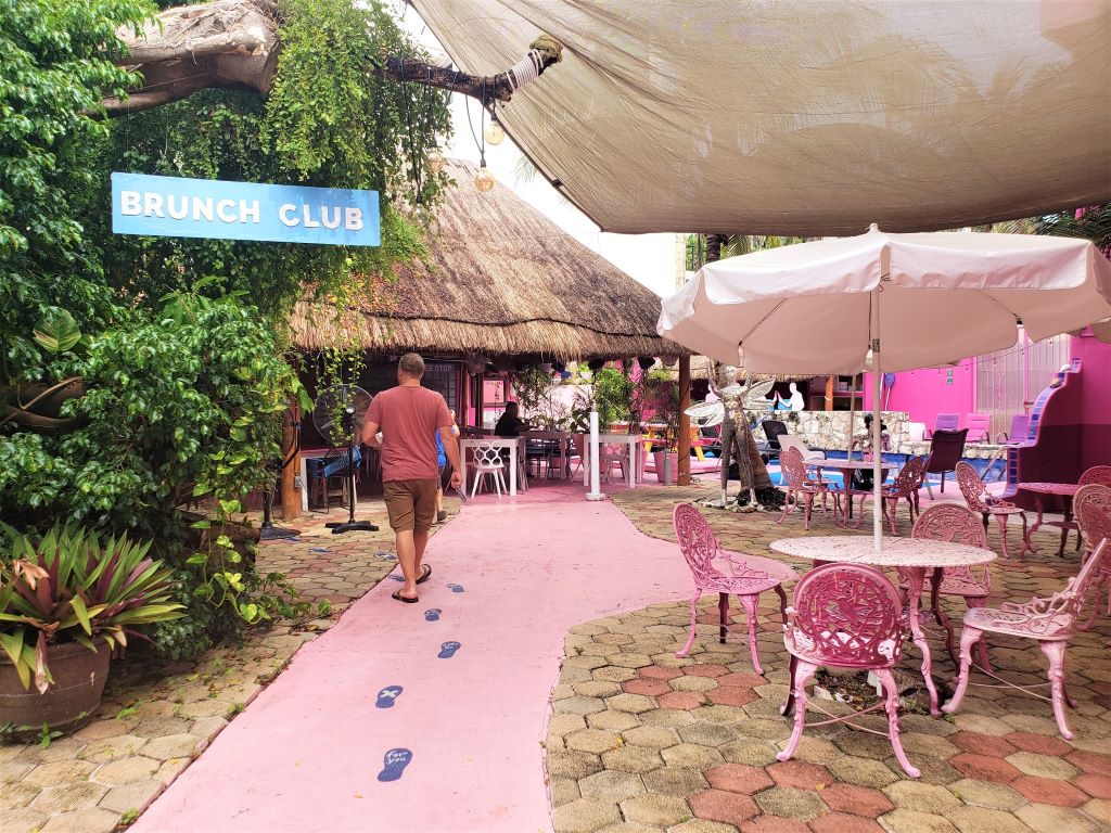 People walking into Chez Waffle restaurant in Playa del Carmen