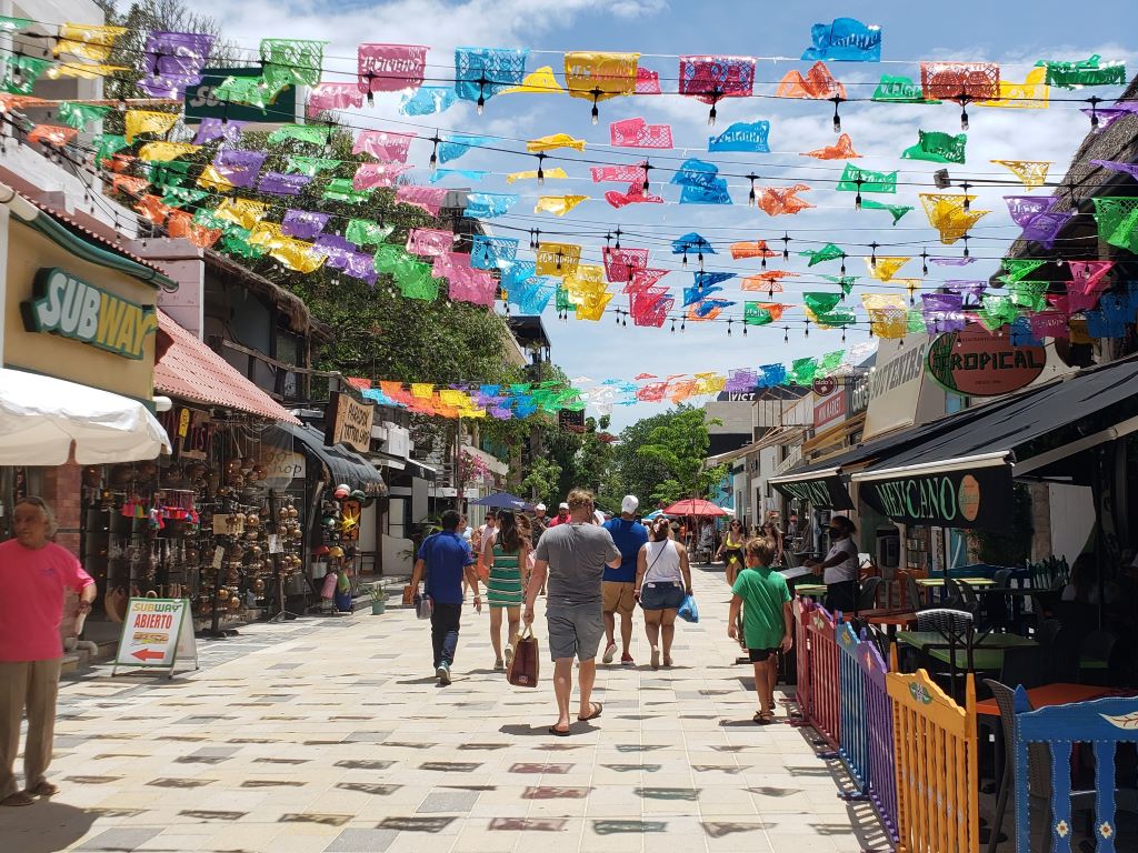 People walking on 5th Avenue in Playa del Carmen.