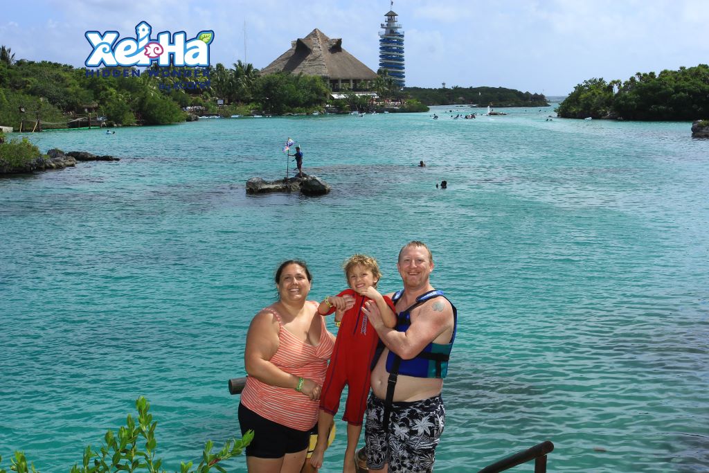 Family photo at the Snorkeling Lagoon in Xel Ha water park in Playa del Carmen