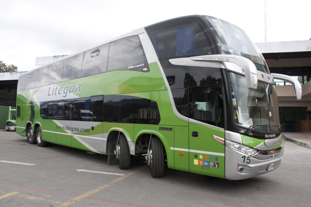 Ligetua Pullman bus sitting in a parking lot.