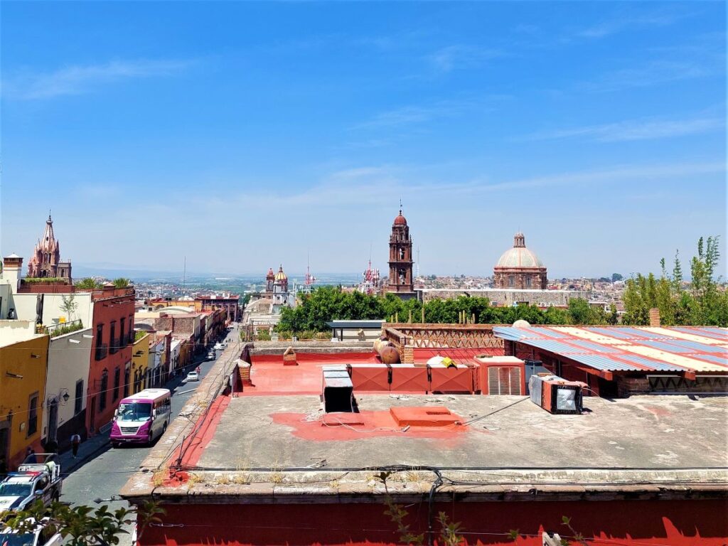 View of the cathedral spires in San Miguel de Allende, as seen from a nearby building rooftop.