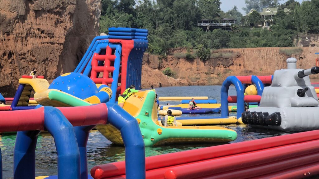 My son with new friends at a waterpark in Thailand