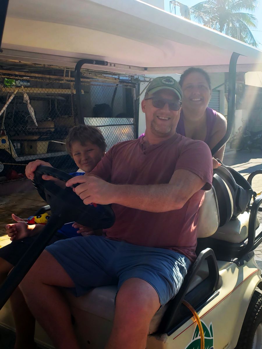 Our family in our Isla Mujeres golf cart rental.