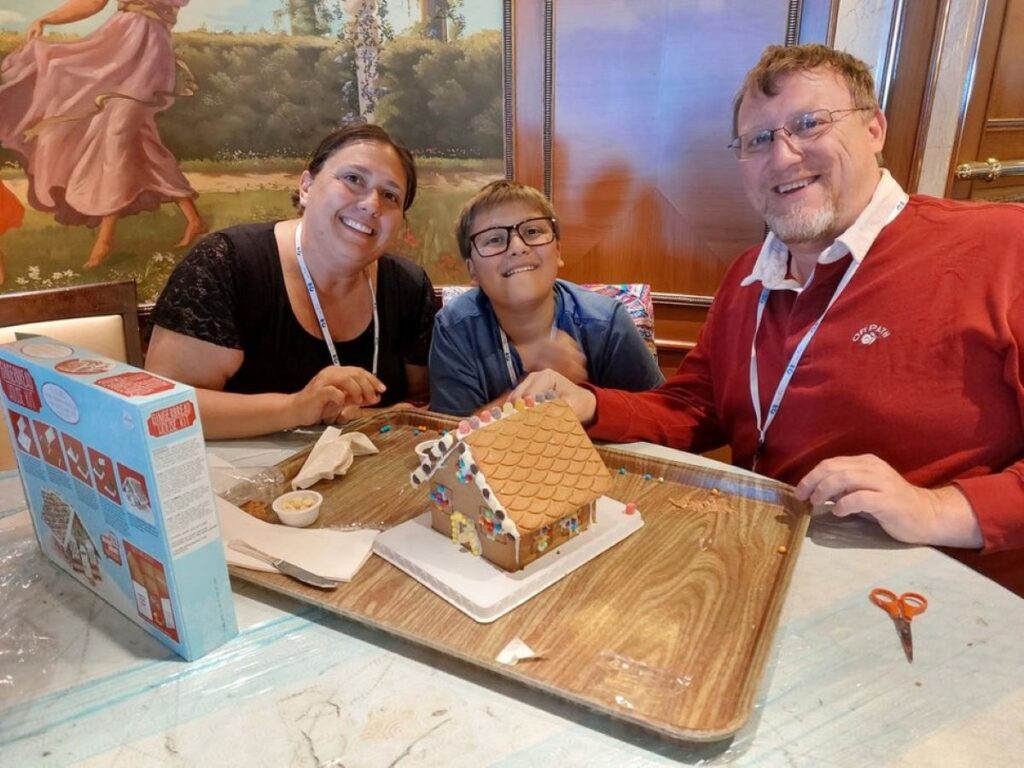 Our family decorating gingerbread houses on our Christmas Antarctica cruise.