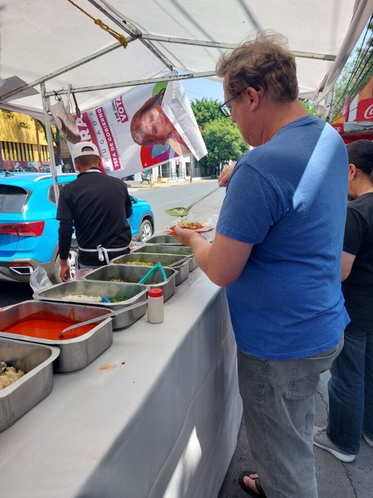 David at a street taco stand in Mexico City